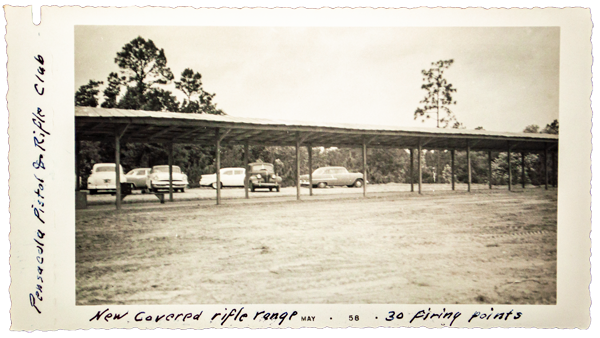 beck's lake rifle range with old cars parked