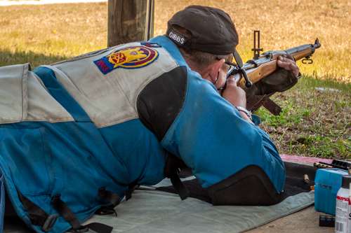 Gibbs shooting a bolt action with ladder site