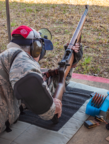 Gibbs shooting a bolt action with ladder site