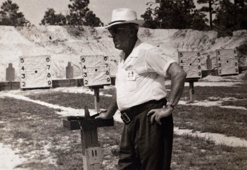 1940s Pistol match, man in white shirt