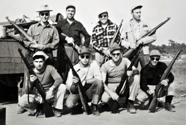 group of competitors who shot the match on the beach