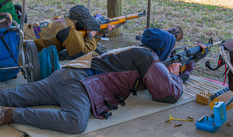 M1 garand with AR type rifle shooting match side by side